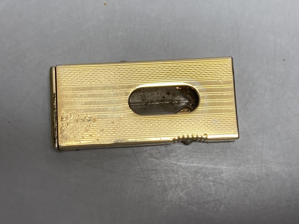 A gold plated Dunhill lighter no. A50077 and a German Dominus cigar cutter